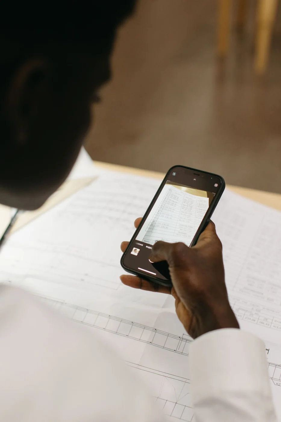 A paper document is captured digitally with a smartphone.